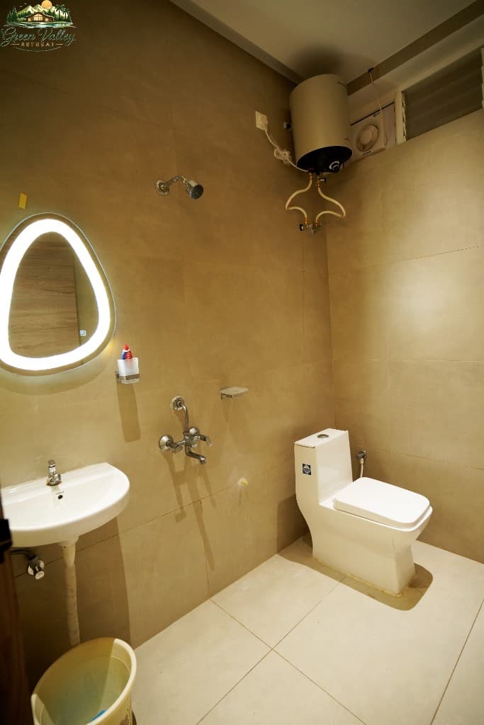 Modern bathroom with LED mirror and hot water facility