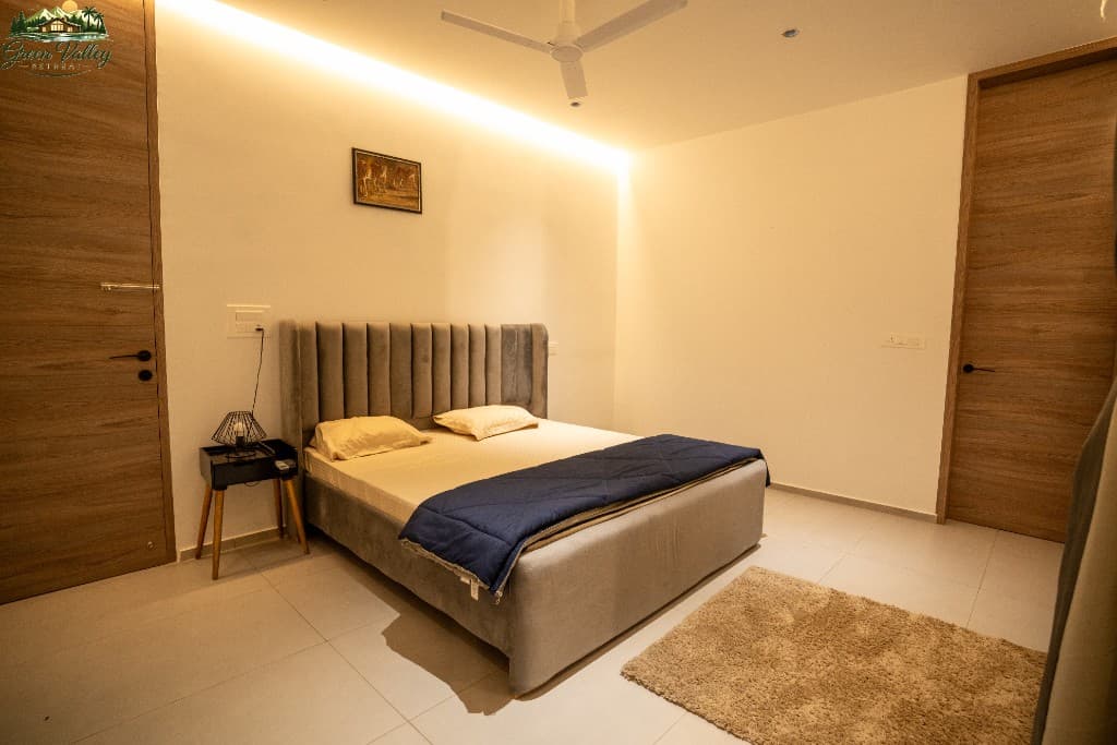 Cosy bedroom with warm mood lighting and wooden accents