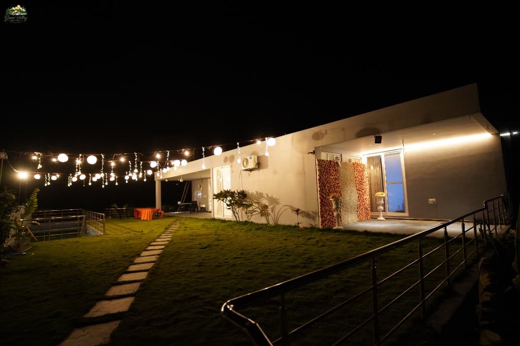 Green Valley Retreat exterior with ambient string lights at night